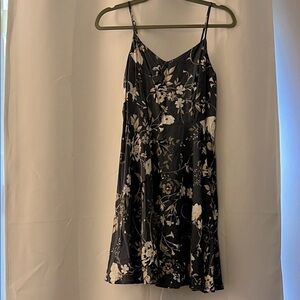 Casual, comfortable dress with floral, vines, butterfly, and bird design.